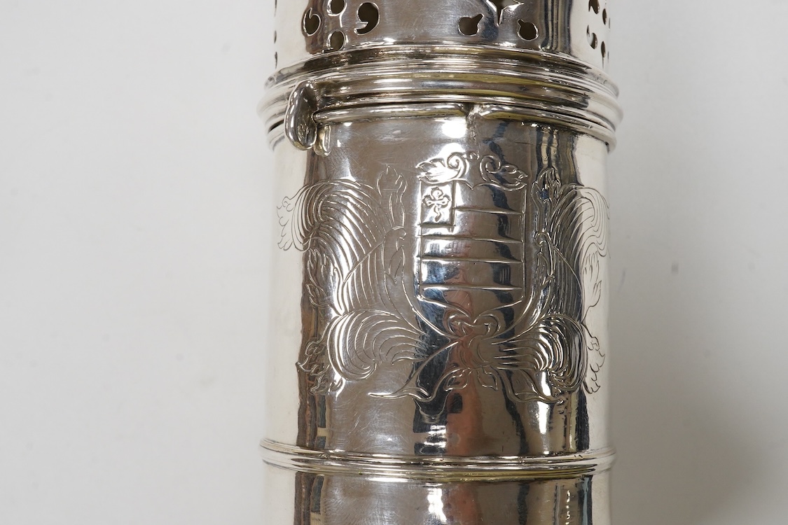 An early 18th century silver lighthouse sugar caster, with later engraved armorial, marks rubbed, London, post 1720, (repaired), height 18.2cm, 10.8oz.